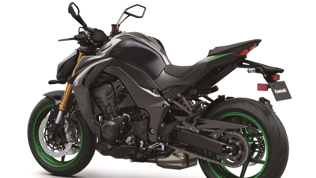 Grey and black Kawasaki sport motorcycle with green rims, shown from a rear-left angle, highlighting the seat, frame, and dual-disc front brakes.