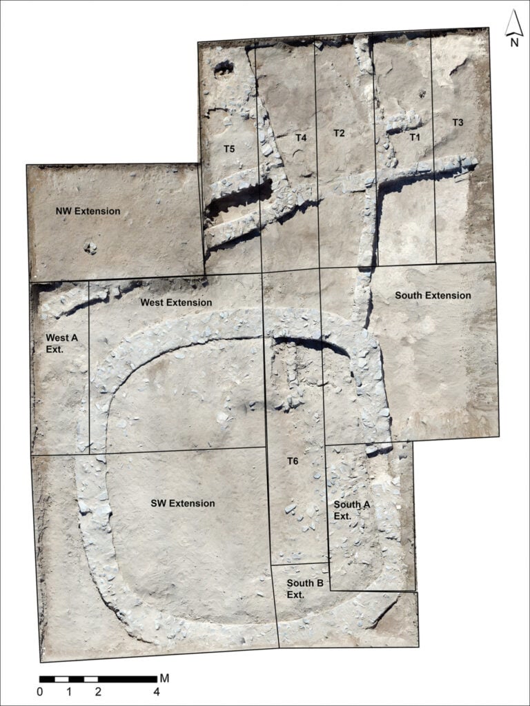 Aerial plan of an excavation with grid lines, labeled extensions (NW, West, SW, South, South A Ext./B Ext.), and trenches T1–T6; includes a north arrow and a scale bar.