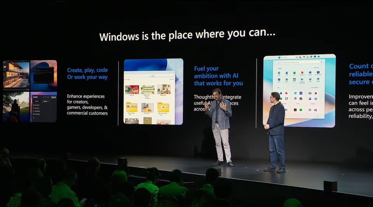 دو سخنران روی صحنه رویداد مایکروسافت در برابر نمایشگر بزرگ با تیتر Windows is the place where you can؛ اسلایدها قابلیت‌های ویندوز شامل ایجاد، بازی و کدنویسی برای سازندگان و گیمرها، ادغام هوش مصنوعی در تجربه‌های کاربری و اپلیکیشن‌های امن و قابل اعتماد را با اسکرین‌شات‌هایی از Copilot و File Explorer و منوی Start نشان می‌دهند و تماشاگران در تاریکی نشسته‌اند.